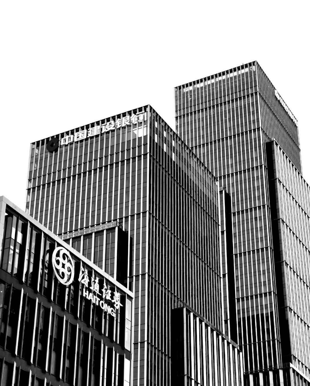 a-black-and-white-photo-of-a-tall-building-ete2p-aql3y